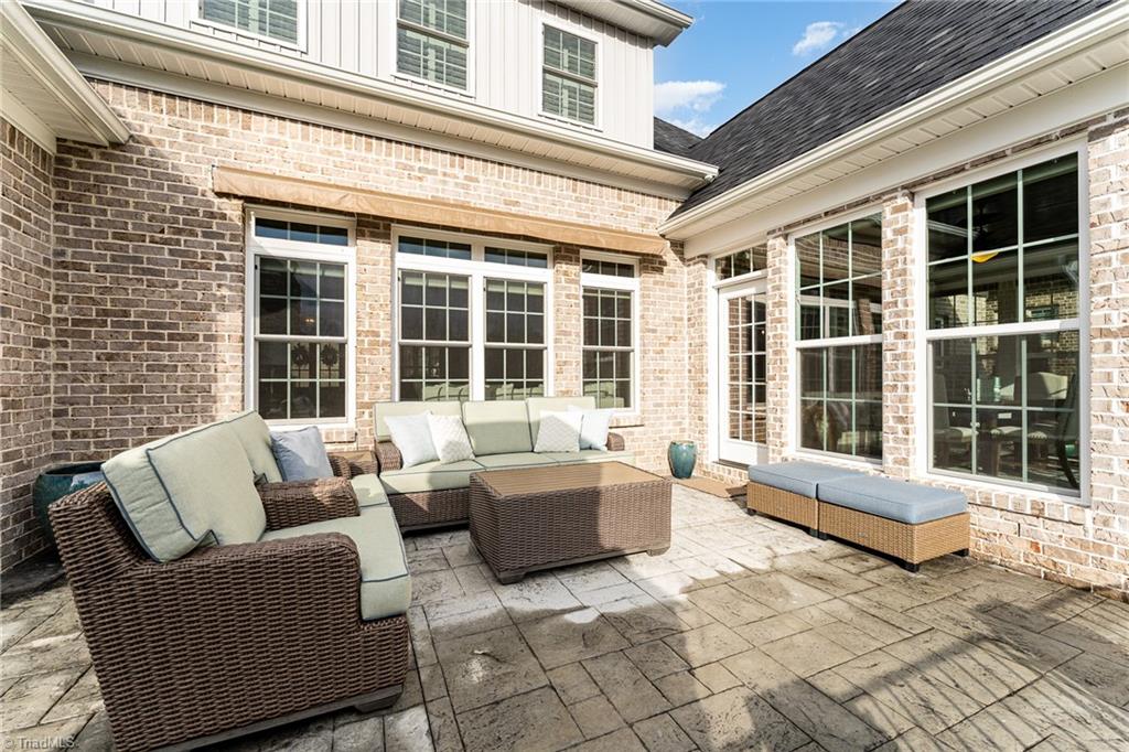 4339 Griffins Gate Road Greensboro, NC 27407 - Photo 38 of 49 Plenty of outdoor seating and the awning will protect you from the sun and rain!