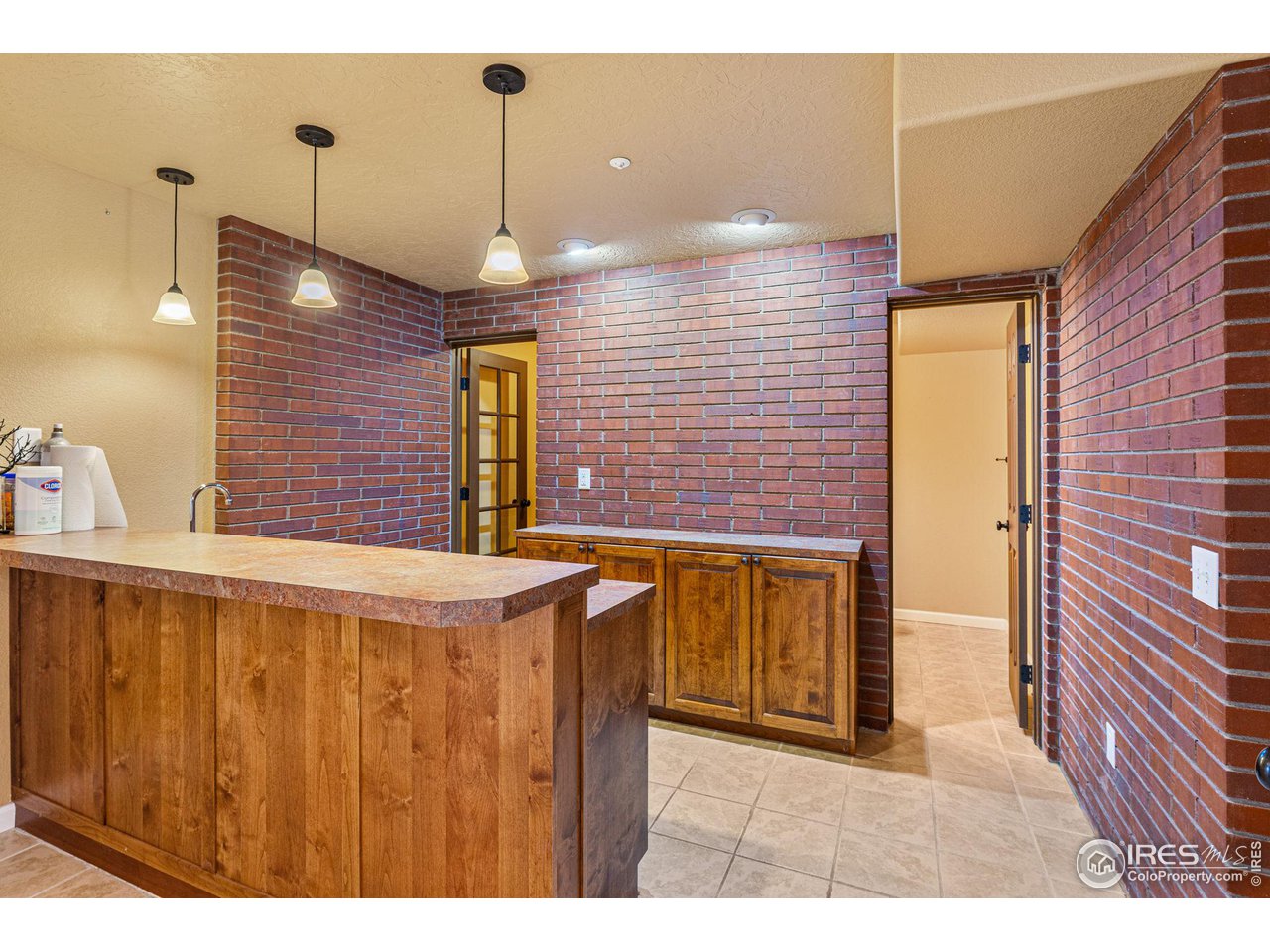 7514 West 19th St Road Greeley, CO 80634 - Photo 20 of 34 Basement Wet Bar w/ Coors Field Bricks!