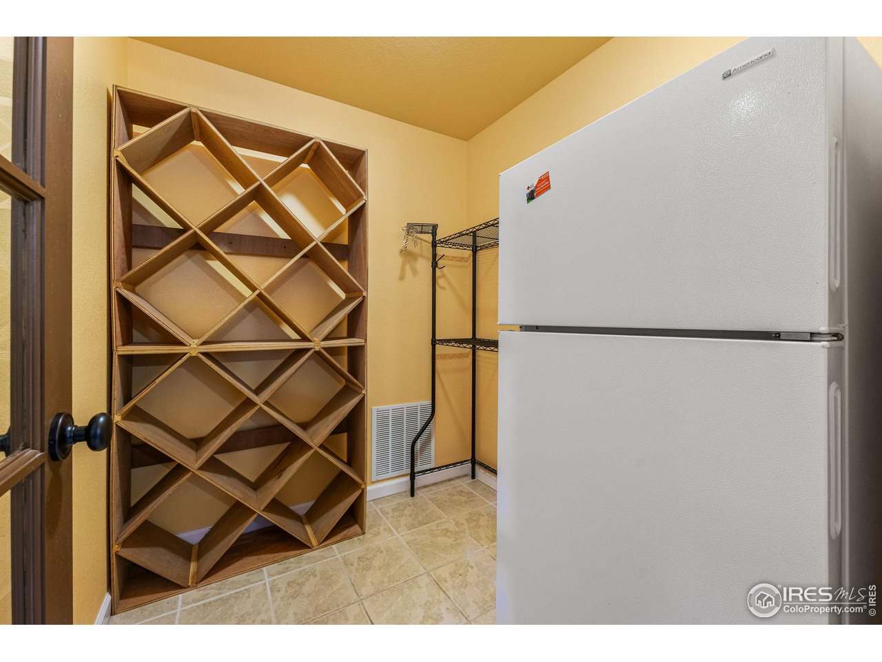 7514 West 19th St Road Greeley, CO 80634 - Photo 25 of 34 Basement Storage Room w/ Wine Rack