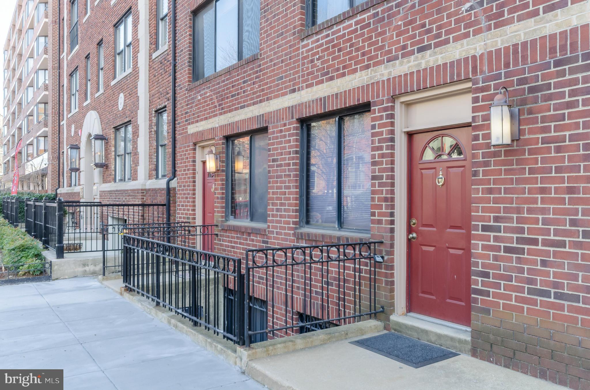 1245 13th Street Northwest, Unit 101 Washington, DC 20005 - Photo 24 of 25 a front view of a building with glass door