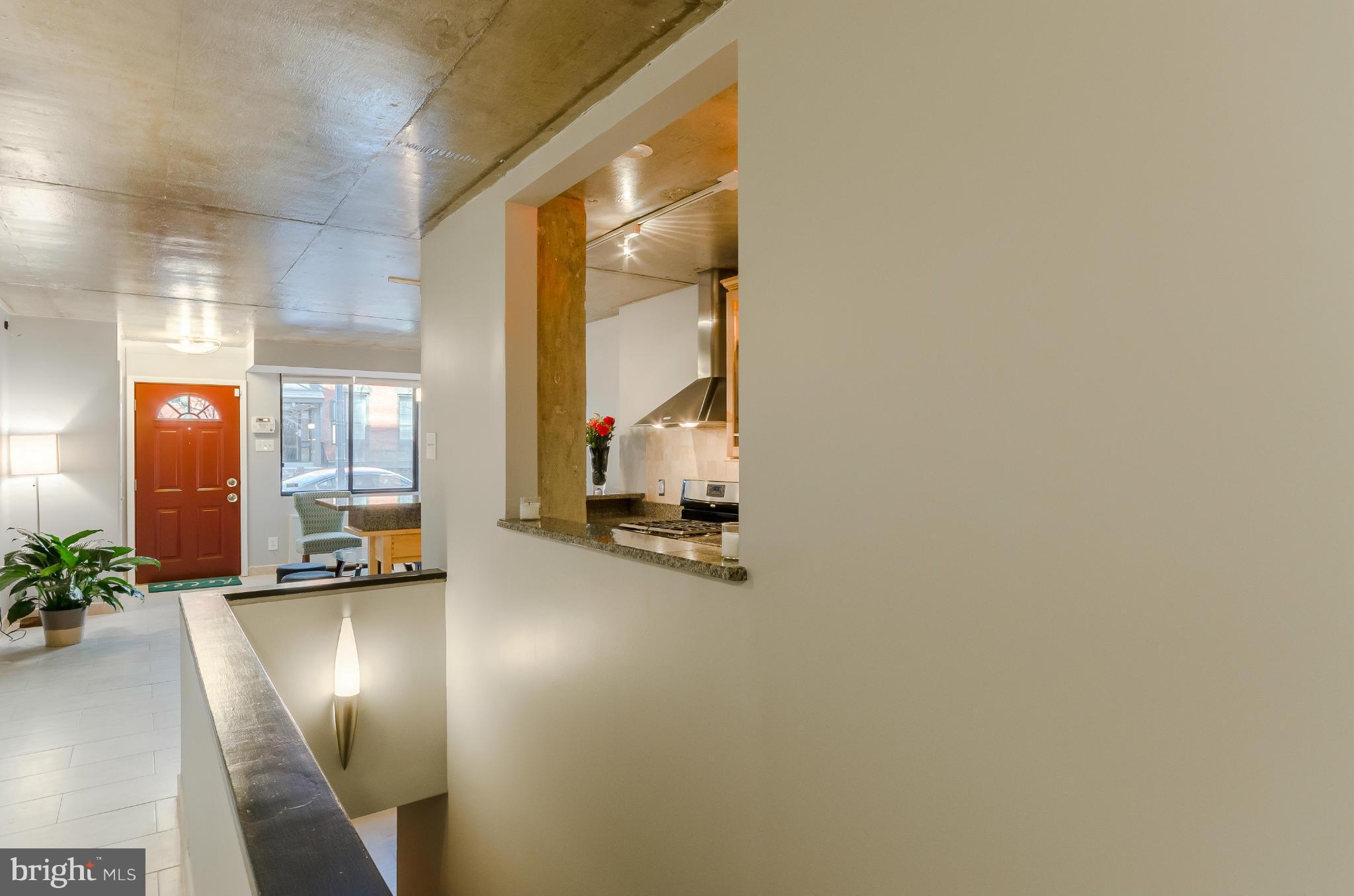 1245 13th Street Northwest, Unit 101 Washington, DC 20005 - Photo 10 of 25 a view of an entryway with a floor to ceiling window
