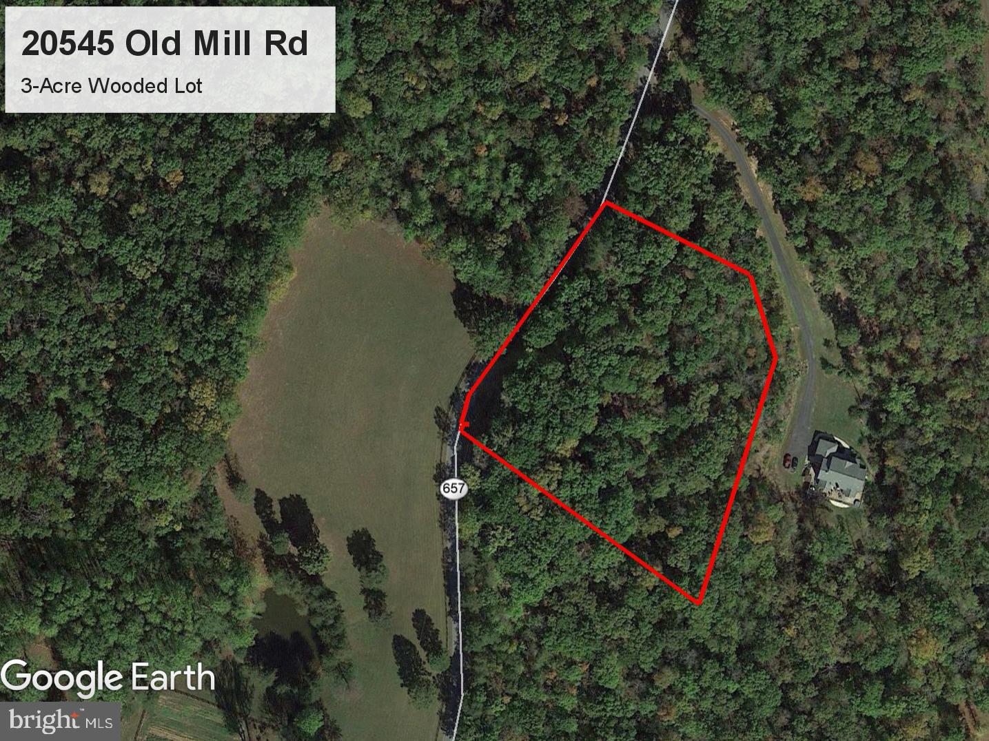 Three acre wooded parcel on a paved state road