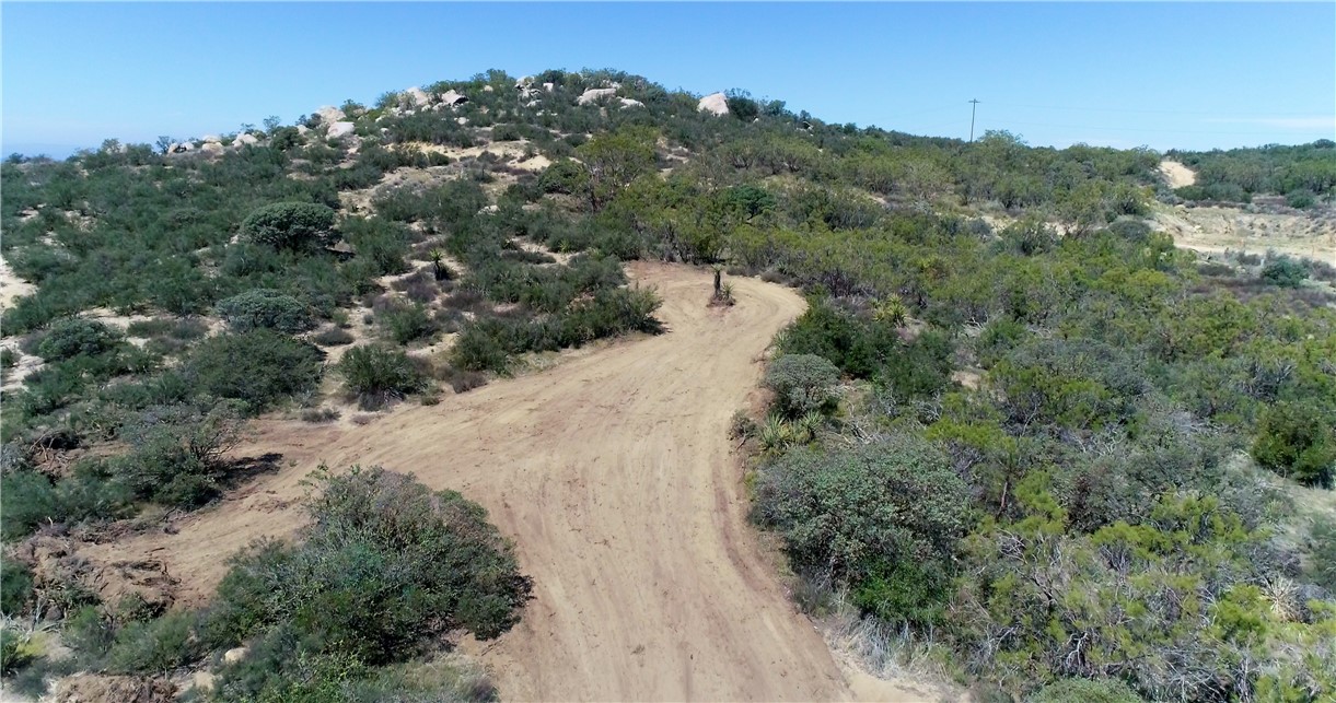 887 Forest Springs Road Aguanga, CA 92536 - Photo 6 of 35 an aerial view of mountain with trees in the background