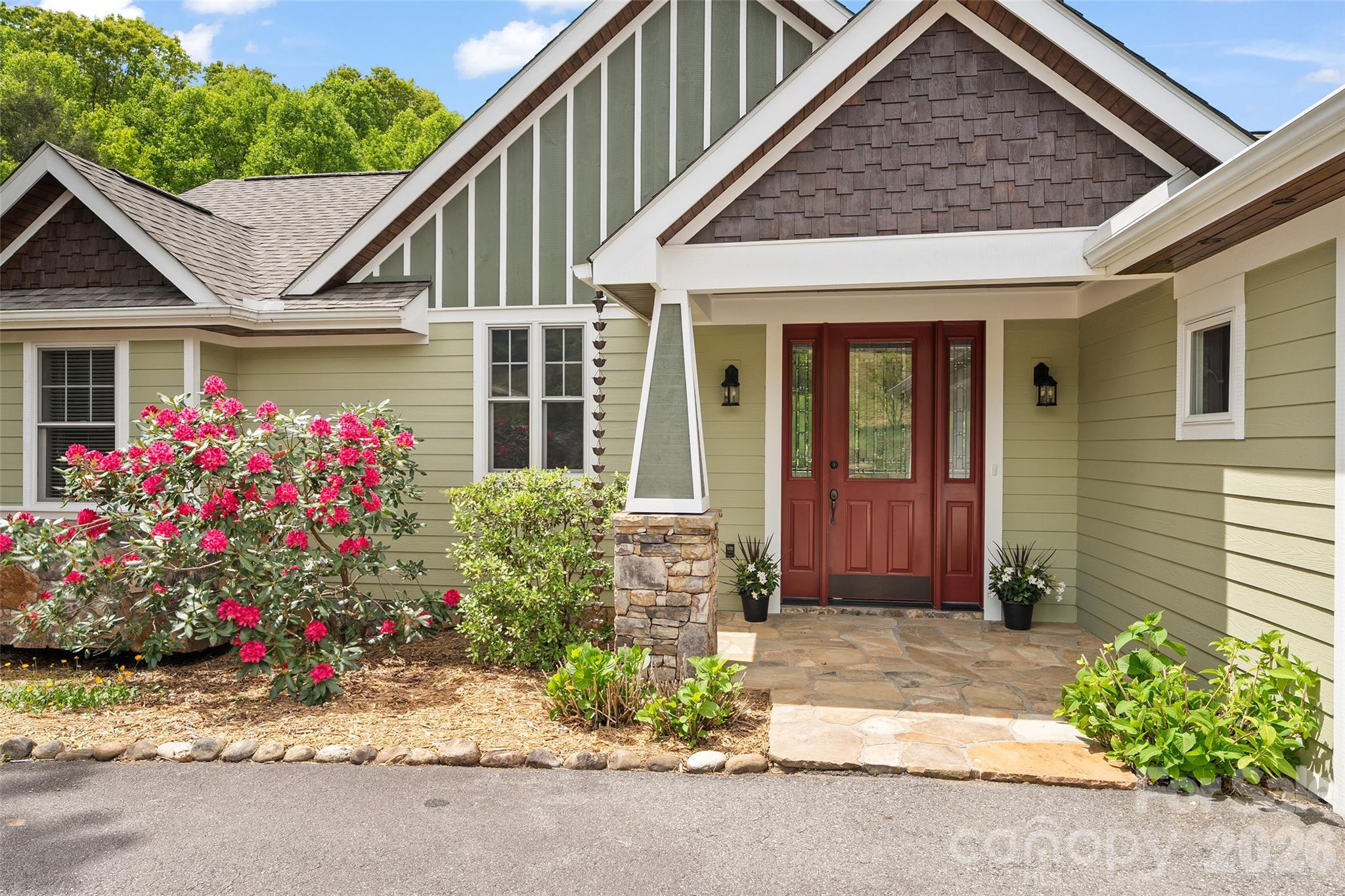 a front view of a house with a yard