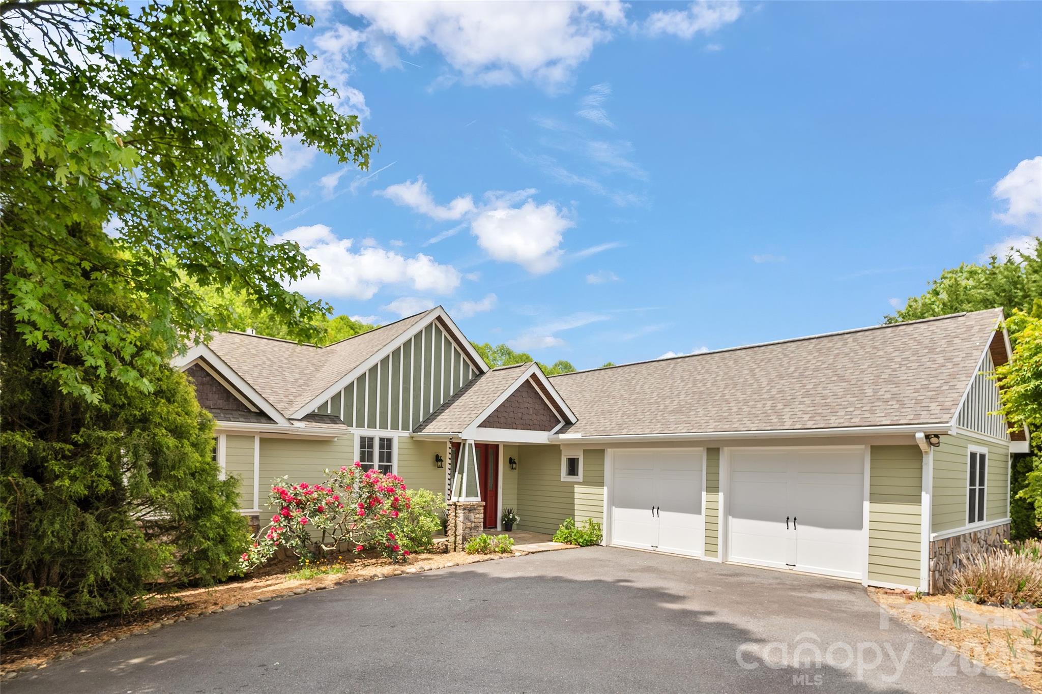 136 Mystic Way Canton, NC 28716 - Photo 2 of 10 a front view of a house with a garden