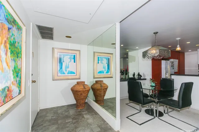 a view of a dining room with furniture and chandelier