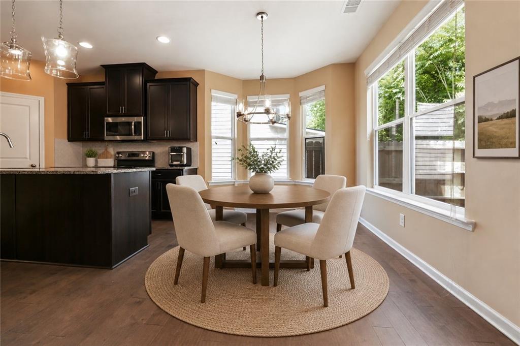4037 Fireoak Drive Decatur, GA 30032 - Photo 5 of 13 a dining room with furniture a chandelier and wooden floor