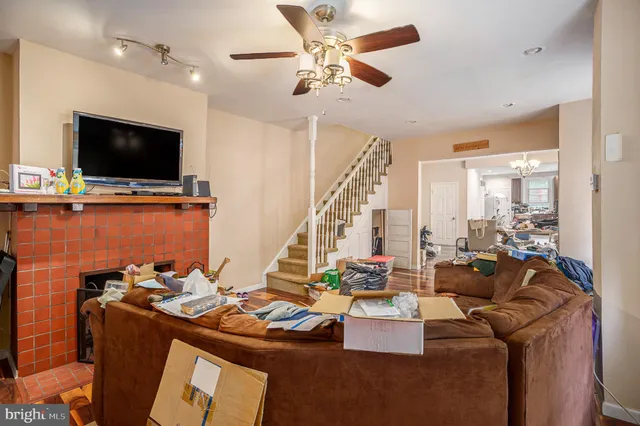 a view of a livingroom with furniture and a flat screen tv