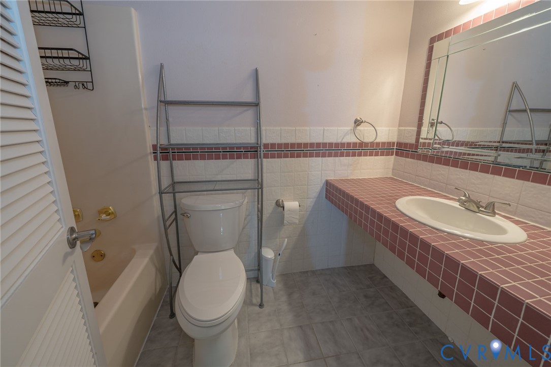 12700 Coalboro Road Chesterfield, VA 23838 - Photo 31 of 50 Bathroom featuring a tiled vanity with integrated