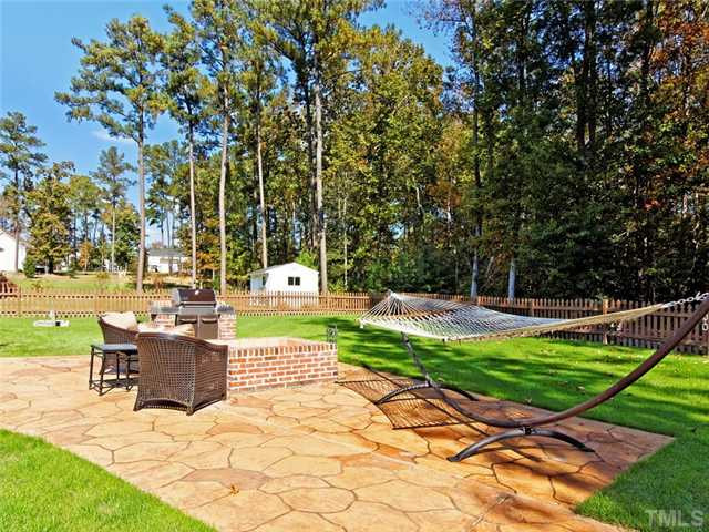 149 Alfred Court Raleigh, NC 27603 - Photo 21 of 24 Stamped Concrete Patio w/ Built In Fire Pit & Built In Gas Grill. Patio/Deck