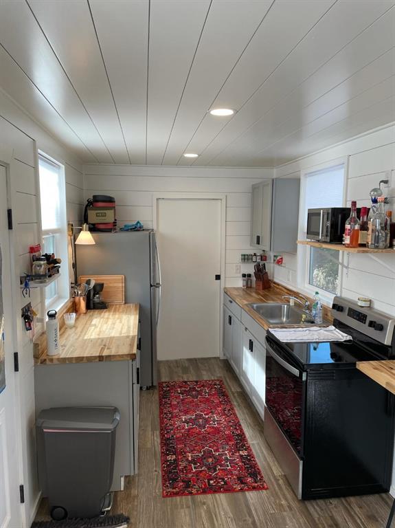 Undisclosed Address Graford, TX 76449 - Photo 15 of 16 a kitchen with a stove sink and cabinets