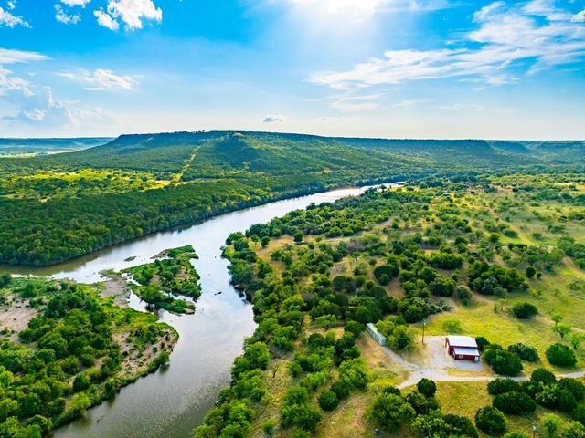 Undisclosed Address Graford, TX 76449 - Photo 2 of 16 a view of a lake with a yard