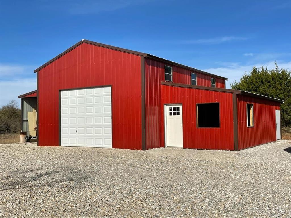 Undisclosed Address Graford, TX 76449 - Photo 6 of 16 a front view of a house with a yard