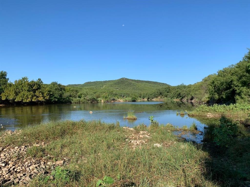 Undisclosed Address Graford, TX 76449 - Photo 8 of 16 a view of a lake in middle of forest