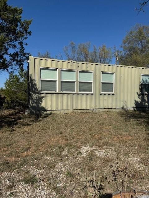 Undisclosed Address Graford, TX 76449 - Photo 9 of 16 a front view of a house with a yard