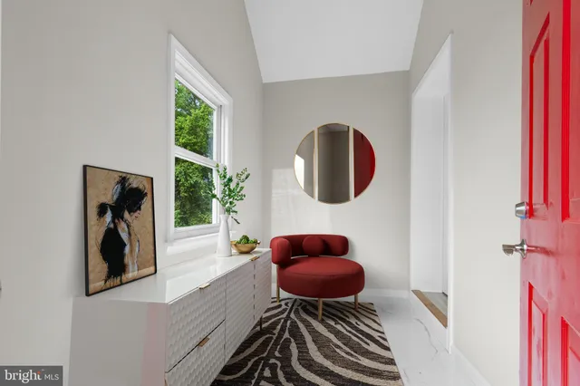 a view of a living room and a potted plant