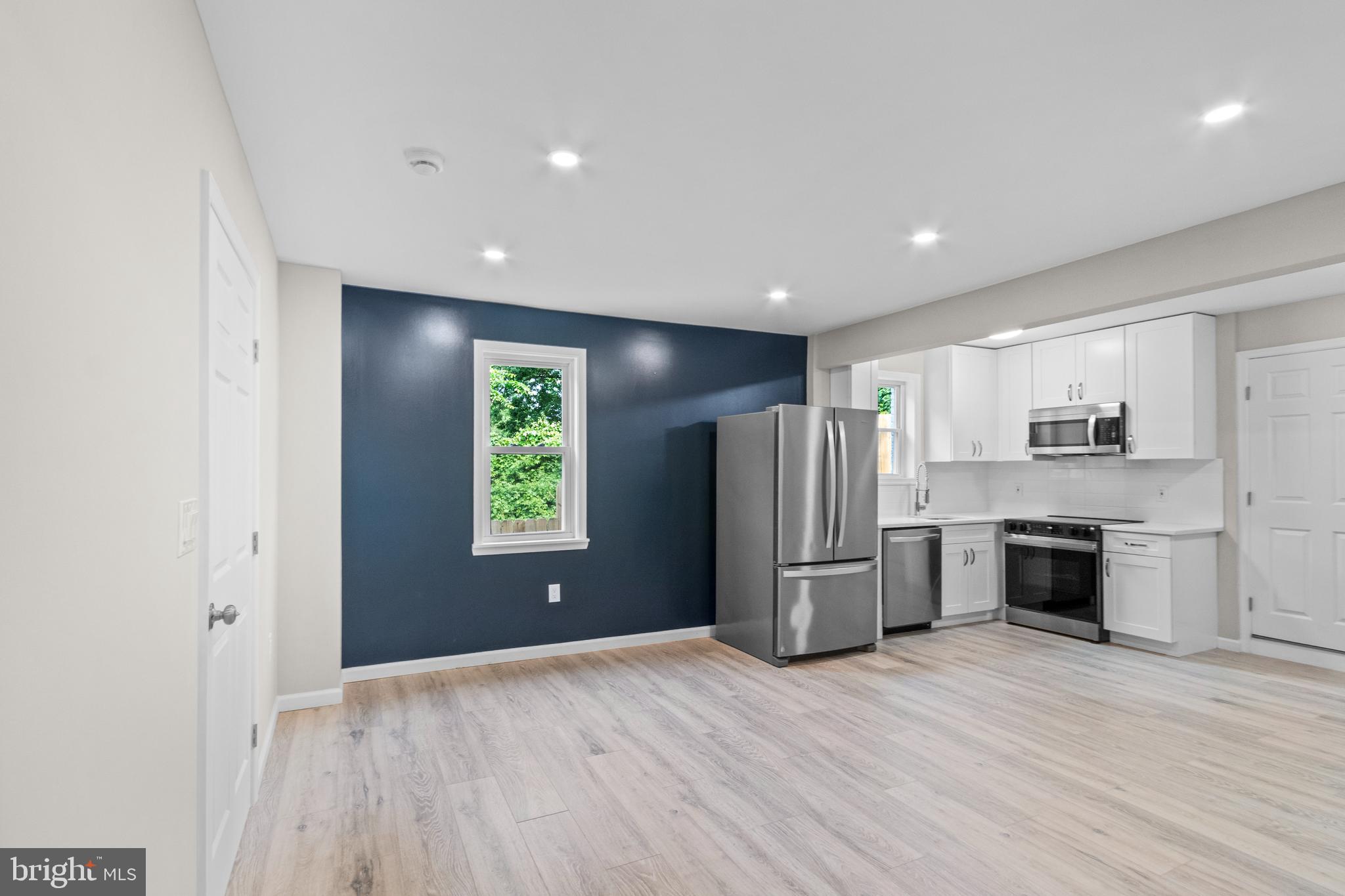 5021 A Street Southeast Washington, DC 20019 - Photo 11 of 43 a open kitchen with a refrigerator and a stove top oven