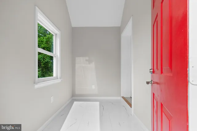 an empty room with windows