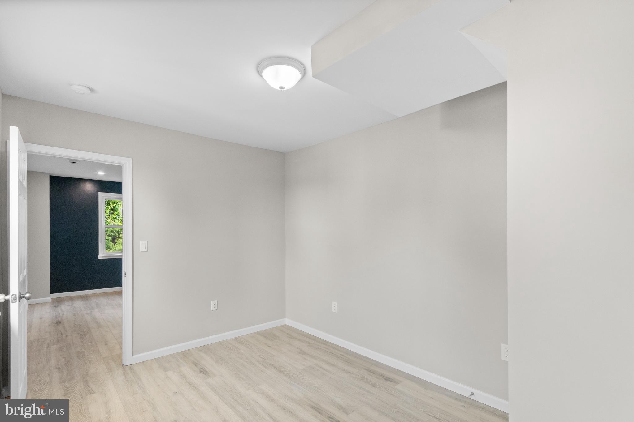 5021 A Street Southeast Washington, DC 20019 - Photo 13 of 43 a view of an empty room with wooden floor