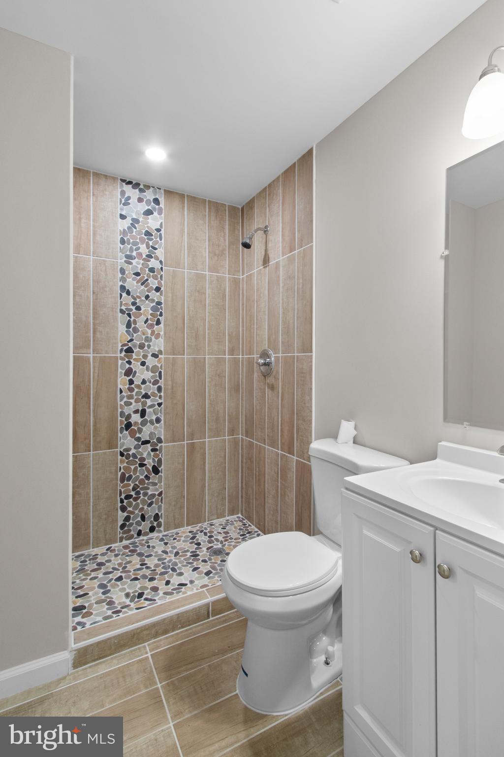 5021 A Street Southeast Washington, DC 20019 - Photo 22 of 43 a bathroom with a sink a toilet and shower