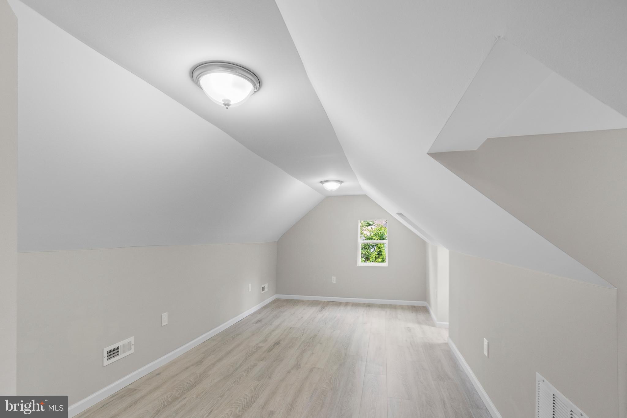 5021 A Street Southeast Washington, DC 20019 - Photo 26 of 43 wooden floor in an empty room with a window