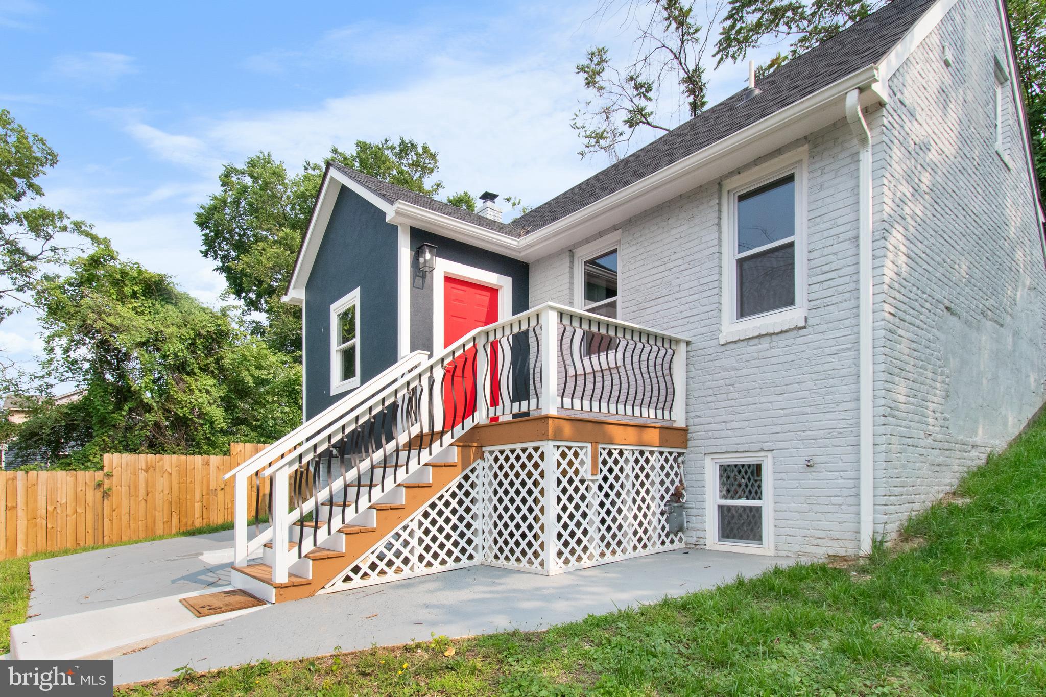 5021 A Street Southeast Washington, DC 20019 - Photo 3 of 43 a front view of a house with a yard