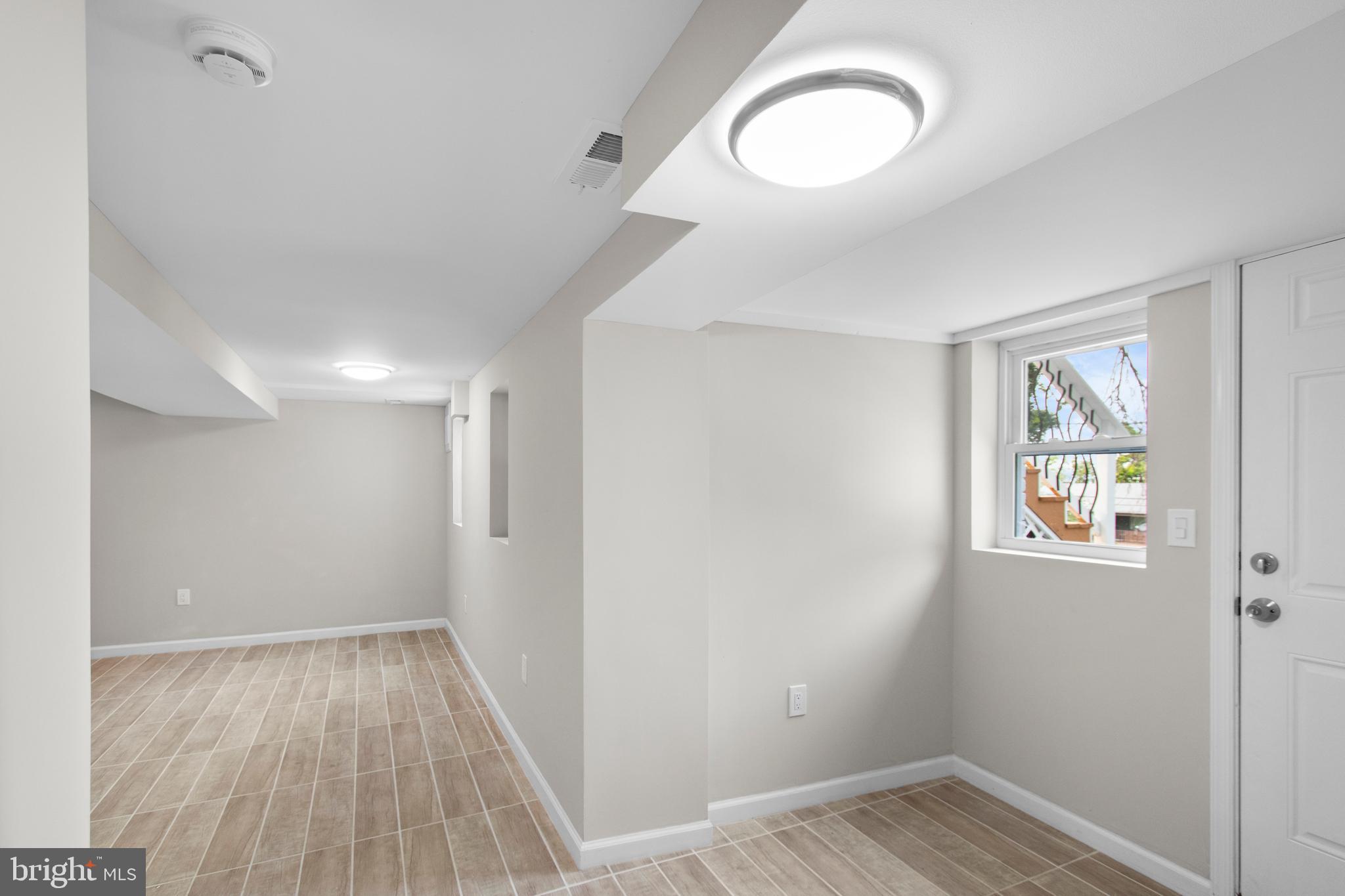 5021 A Street Southeast Washington, DC 20019 - Photo 35 of 43 a view of a room with wooden floor and window