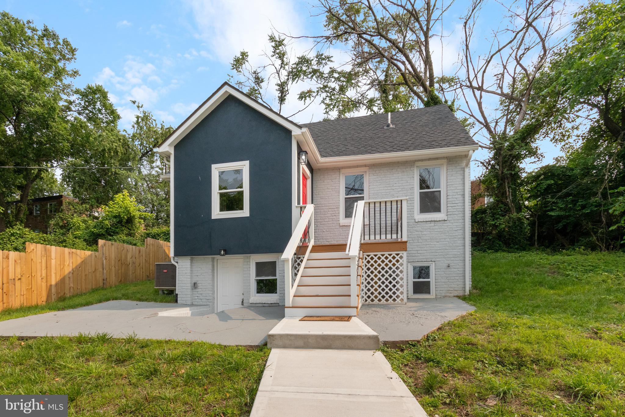 5021 A Street Southeast Washington, DC 20019 - Photo 6 of 43 a front view of a house with a yard