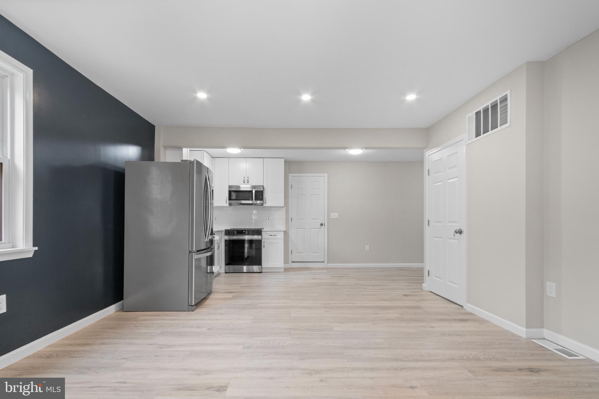 5021 A Street Southeast Washington, DC 20019 - Photo 9 of 43 a view of an empty room with kitchen and window