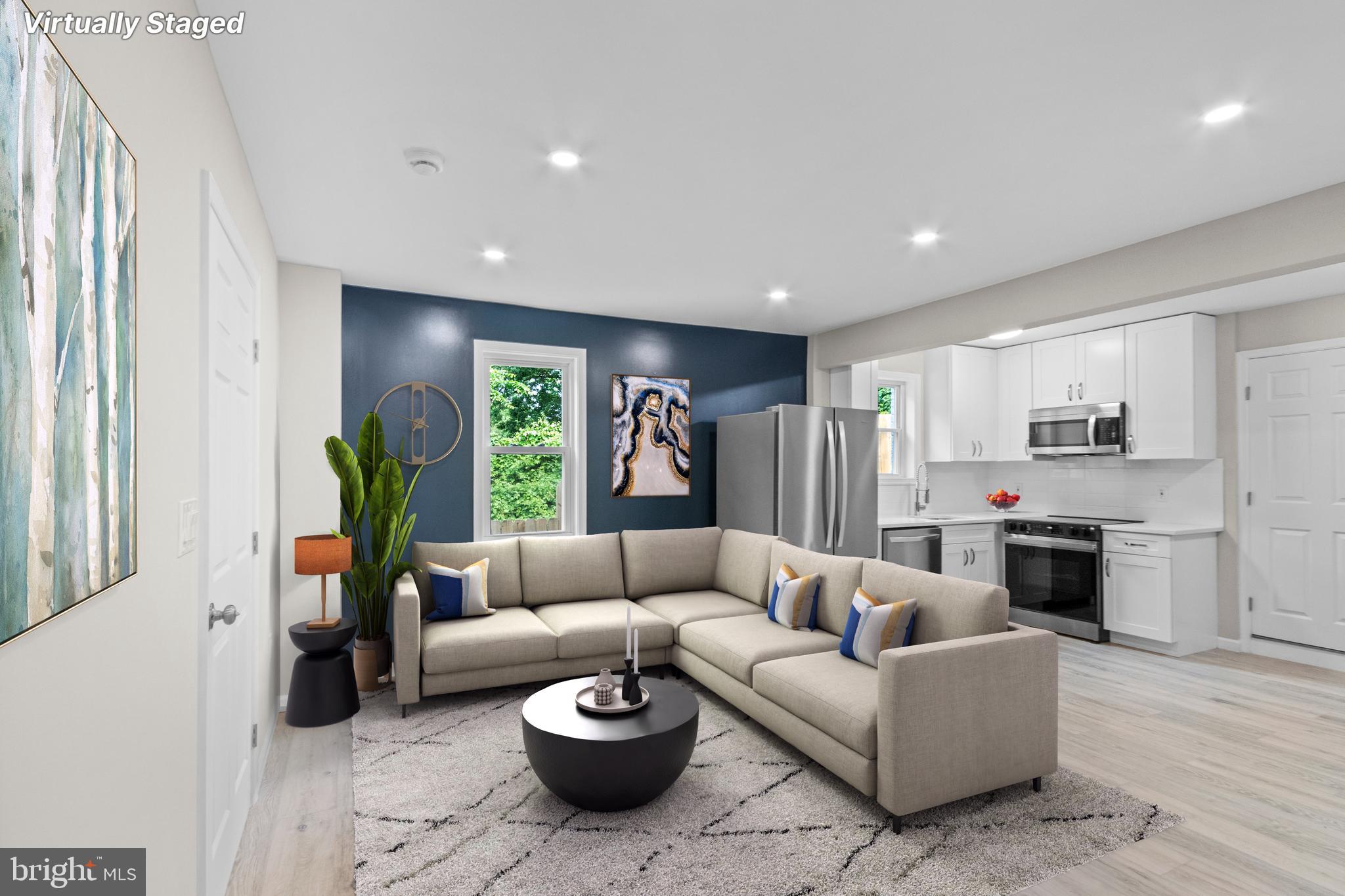 5021 A Street Southeast Washington, DC 20019 - Photo 10 of 43 a living room with furniture and a large window