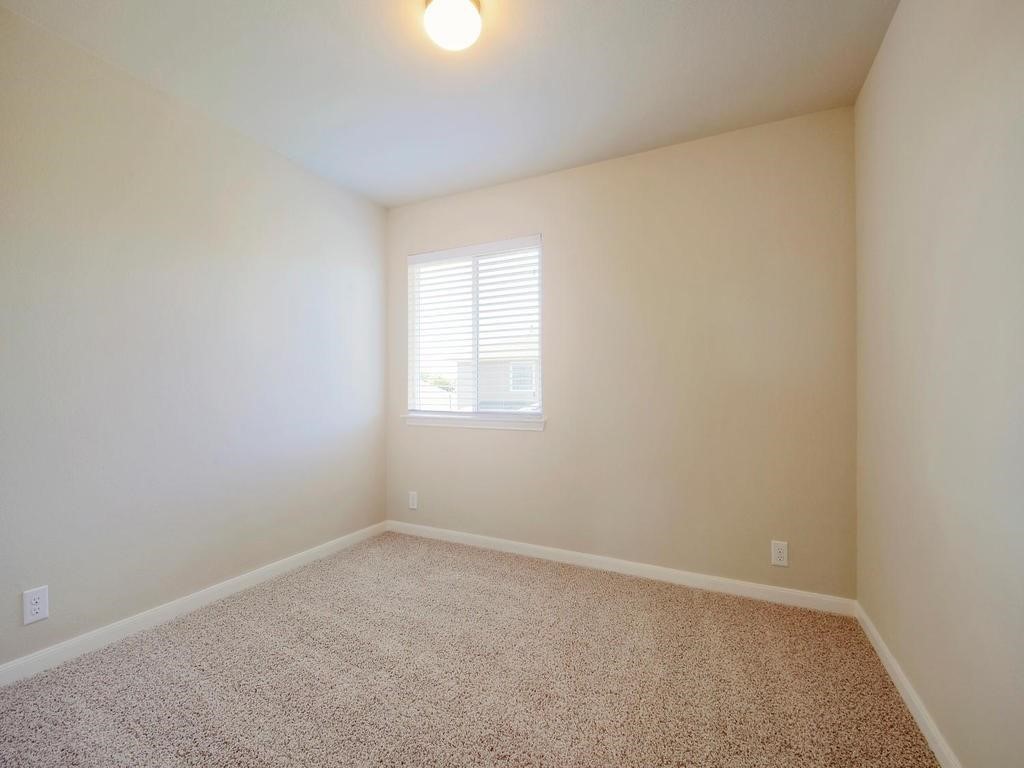 8508 Inca Dove Drive Austin, TX 78729 - Photo 12 of 22 an empty room with a window