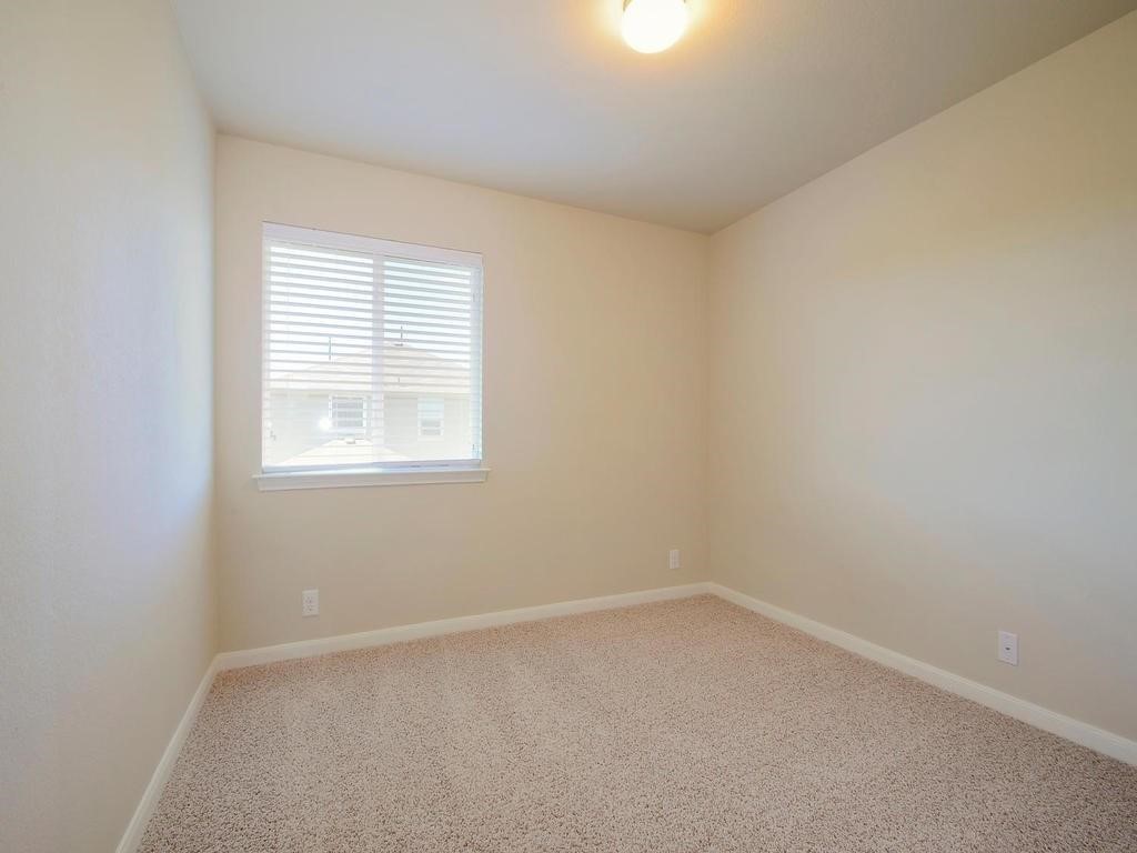 8508 Inca Dove Drive Austin, TX 78729 - Photo 14 of 22 an empty room with a window