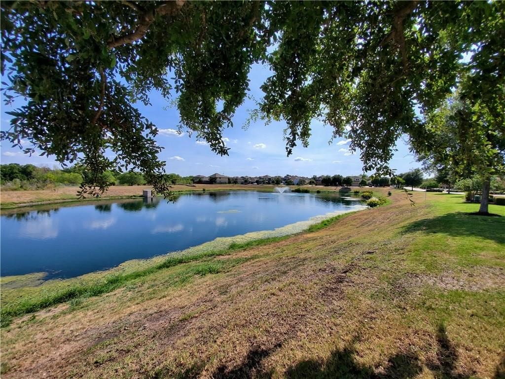 8508 Inca Dove Drive Austin, TX 78729 - Photo 21 of 22 a view of a lake with houses in the background