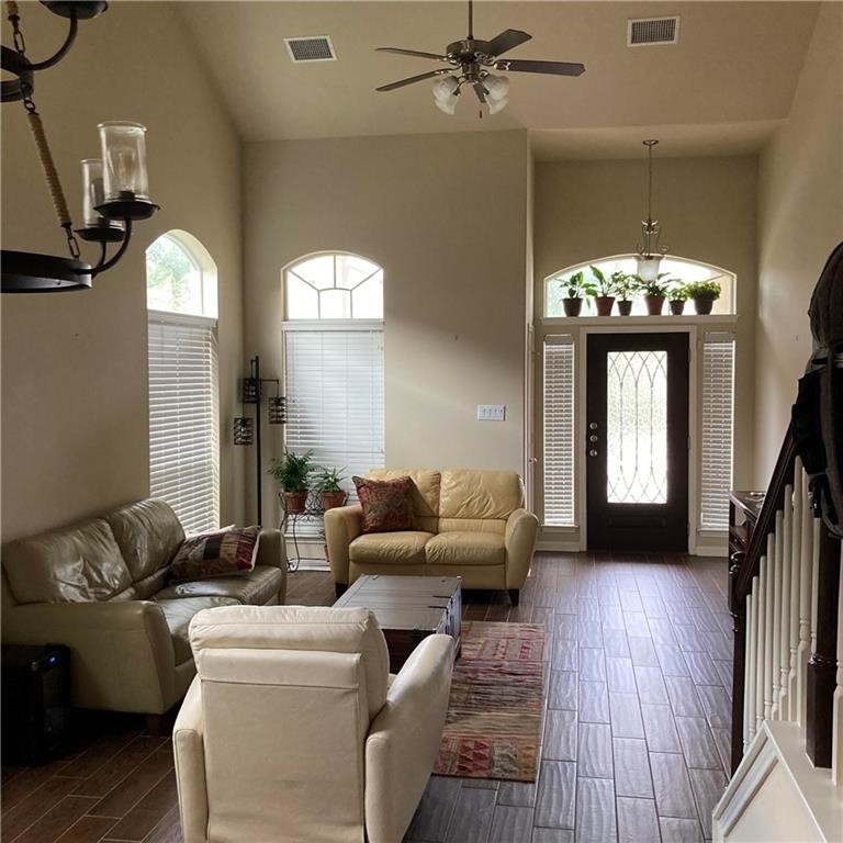 8508 Inca Dove Drive Austin, TX 78729 - Photo 5 of 22 a living room with furniture and a chandelier