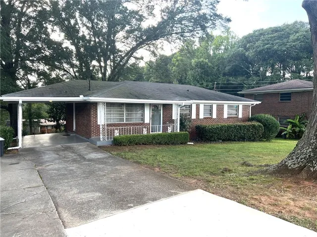 front view of a house with a yard