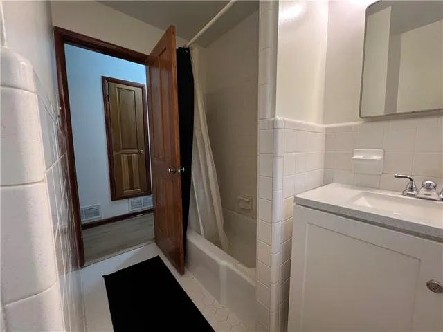 a bathroom with a sink and mirror