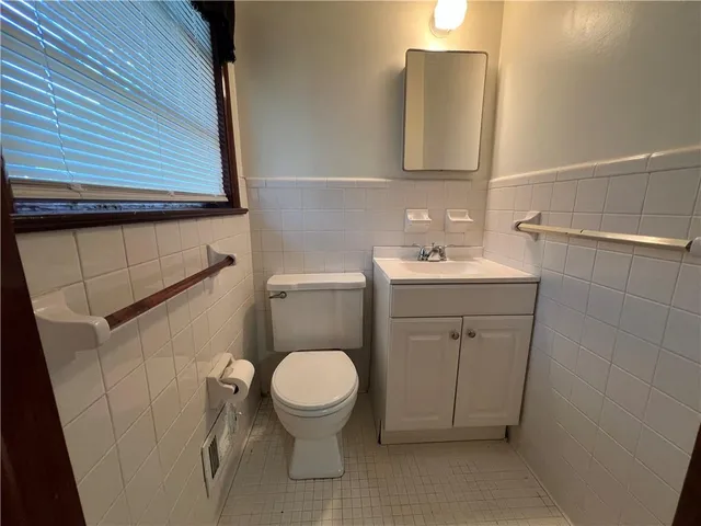 a bathroom with a sink toilet and vanity