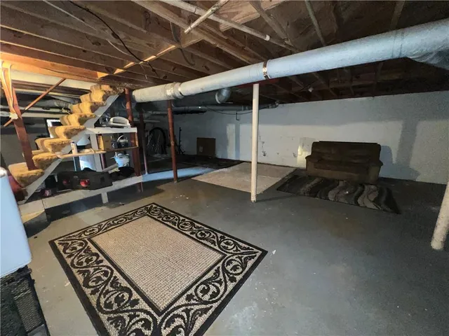 a view of an empty room with furniture