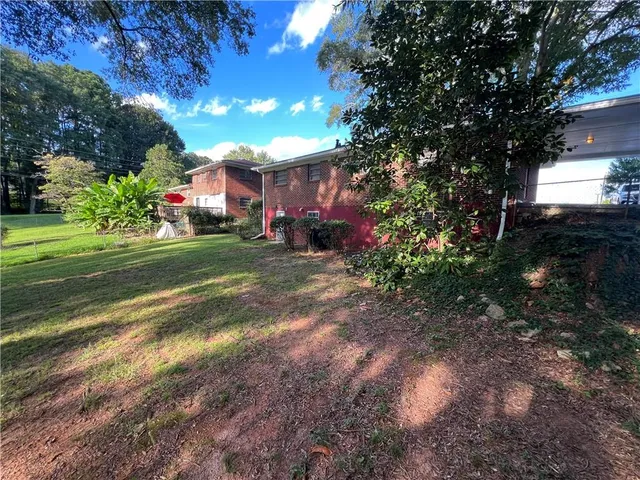 a view of a park with large trees