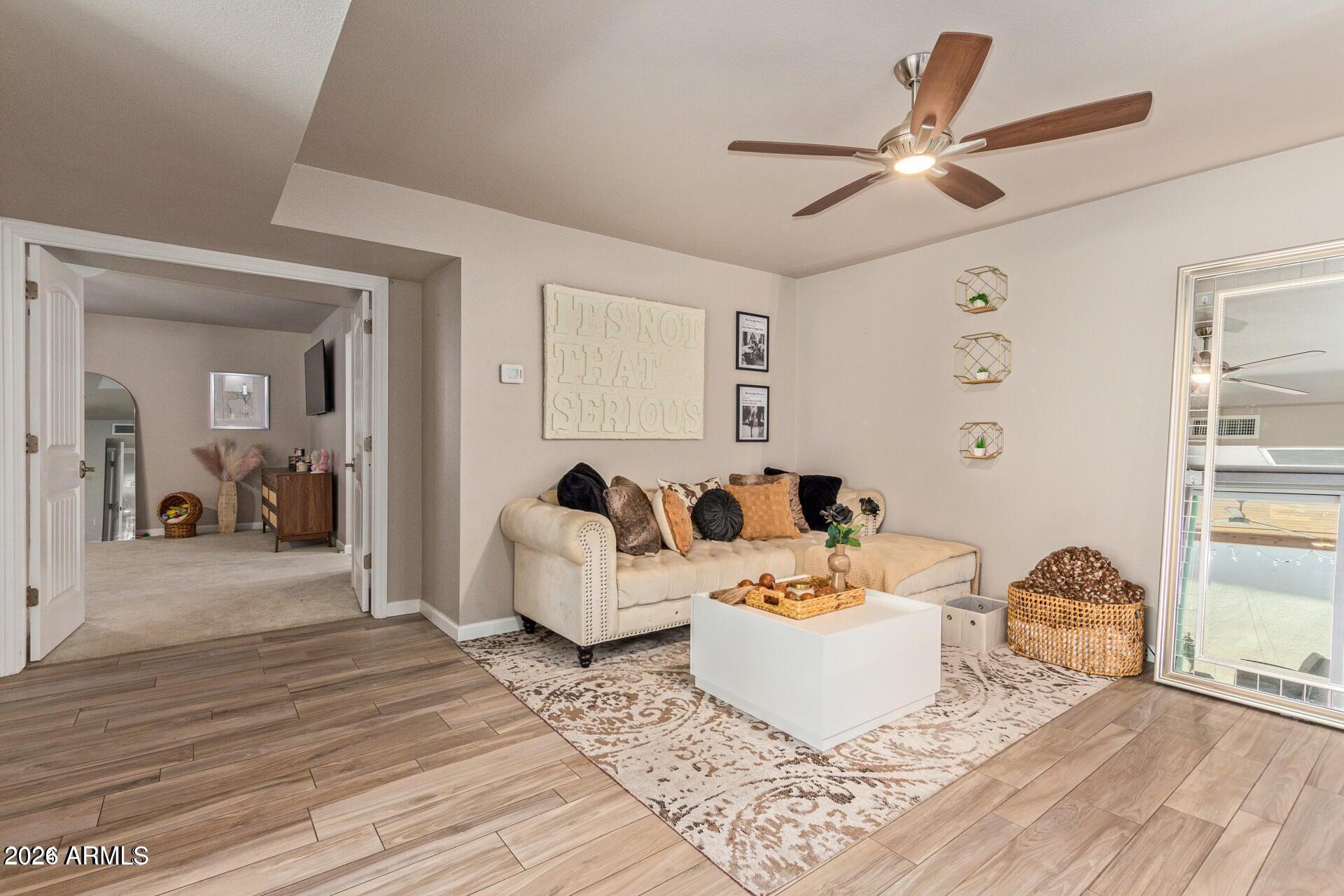 5913 East Thomas Road Scottsdale, AZ 85251 - Photo 9 of 26 a living room with furniture and a wooden floor