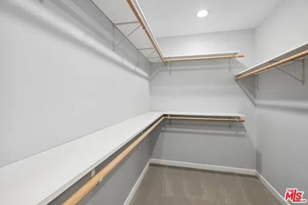 a view of an empty walk in closet