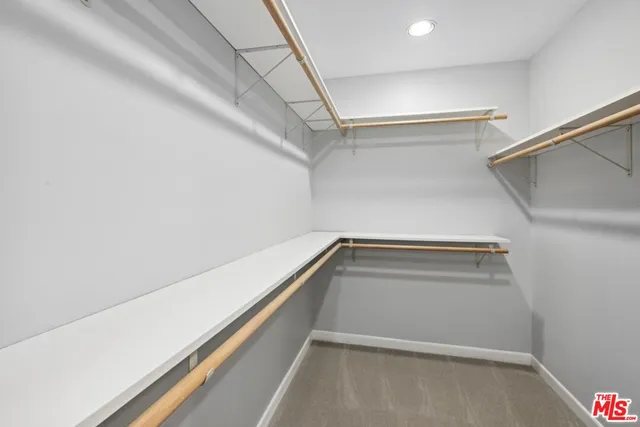 a view of an empty walk in closet