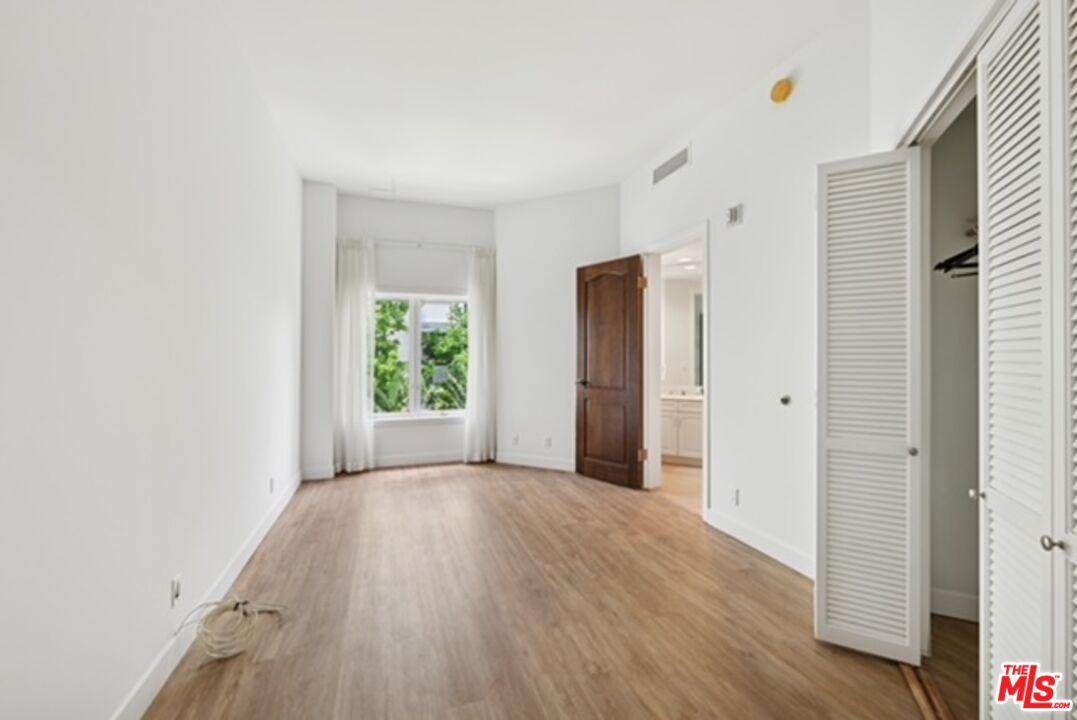 10351 Wilshire Boulevard, Unit PH1 Los Angeles, CA 90024 - Photo 18 of 23 a view of livingroom with hardwood