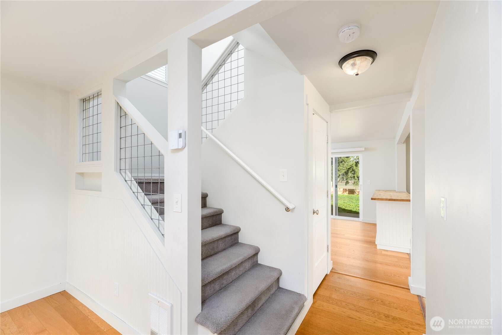 131 Alpine Loop Sequim, WA 98382 - Photo 11 of 40 a view of entryway and hall with wooden floor