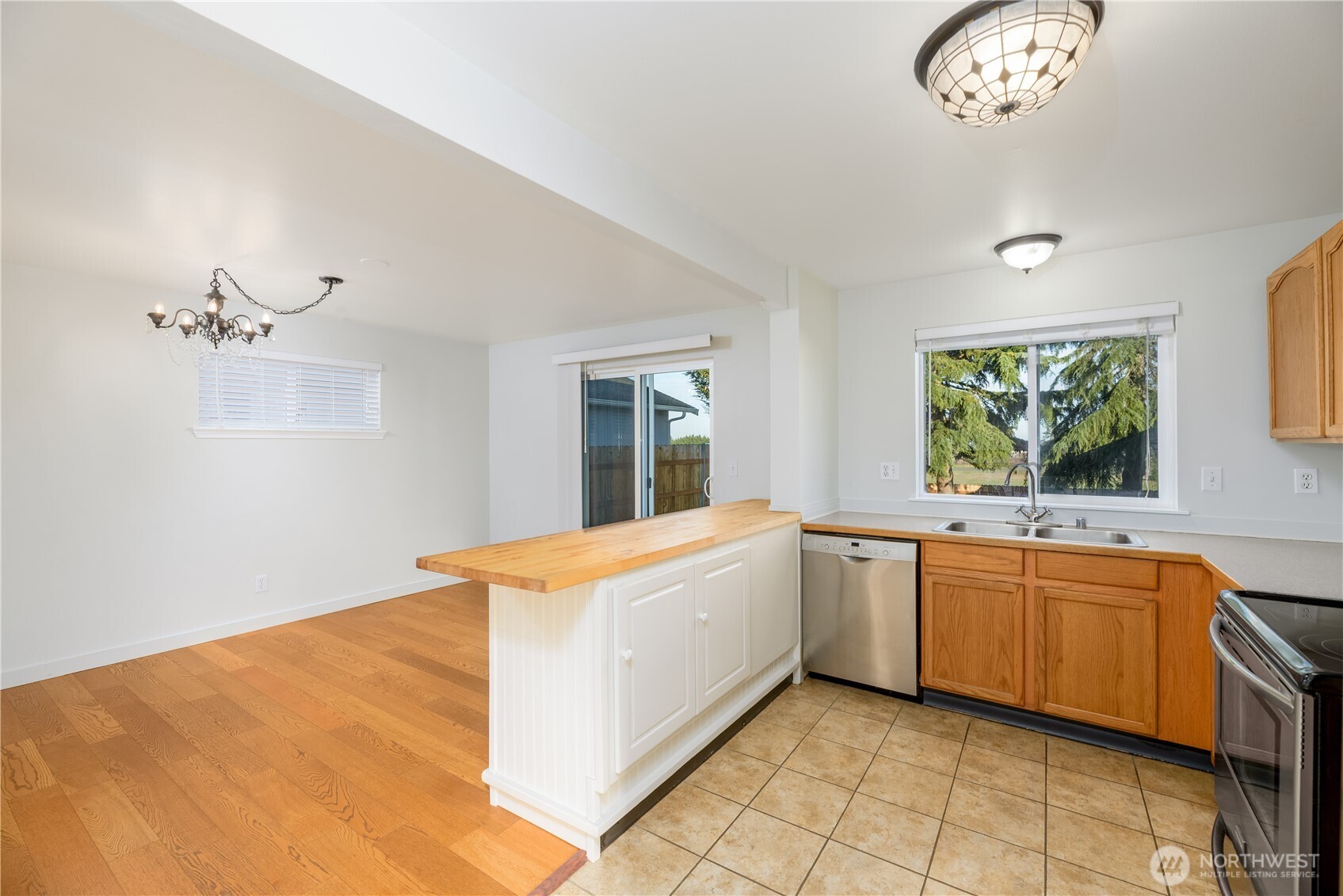 131 Alpine Loop Sequim, WA 98382 - Photo 14 of 40 a large white kitchen with a window