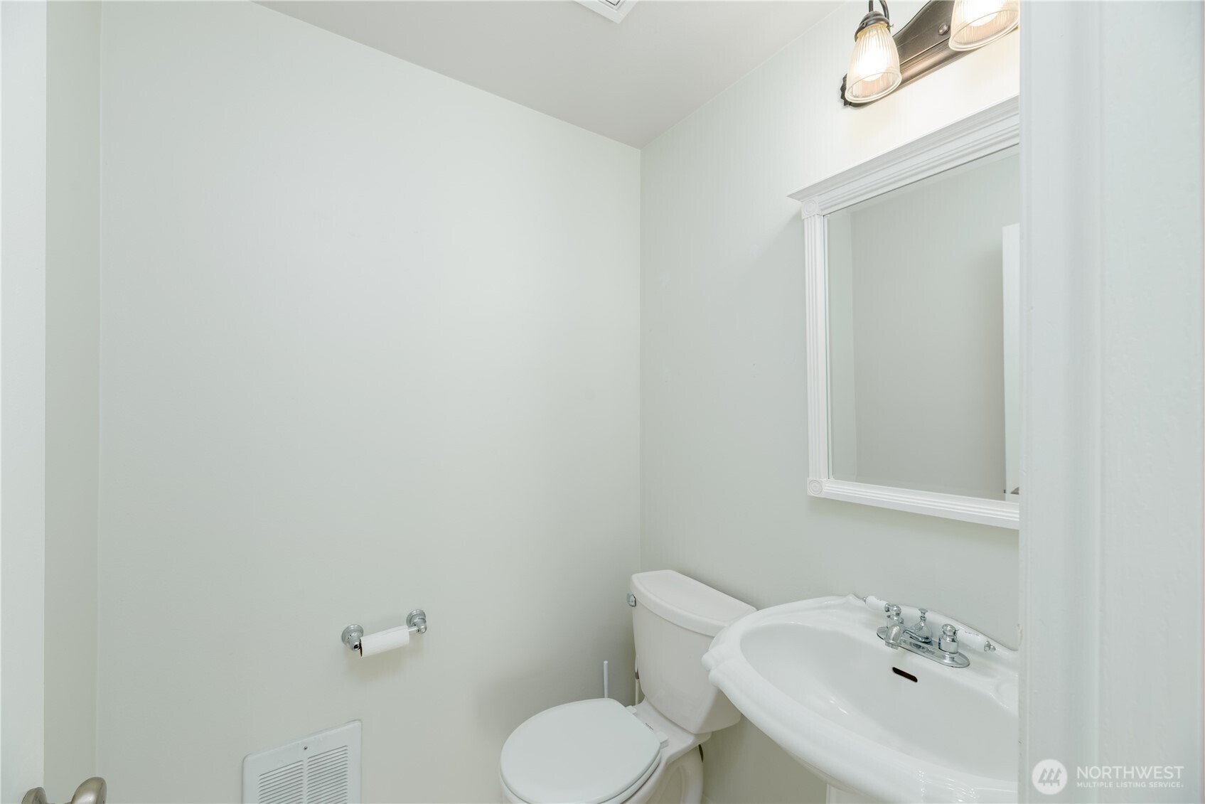 131 Alpine Loop Sequim, WA 98382 - Photo 23 of 40 a bathroom with a toilet sink and mirror