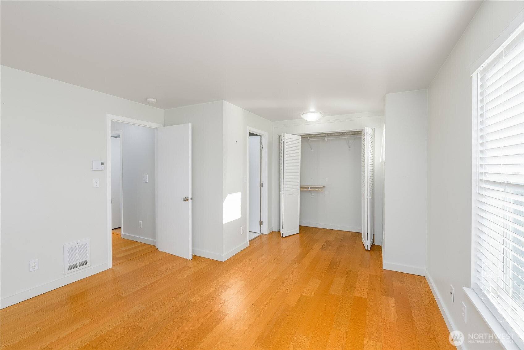 131 Alpine Loop Sequim, WA 98382 - Photo 24 of 40 a bedroom with a bed and a window