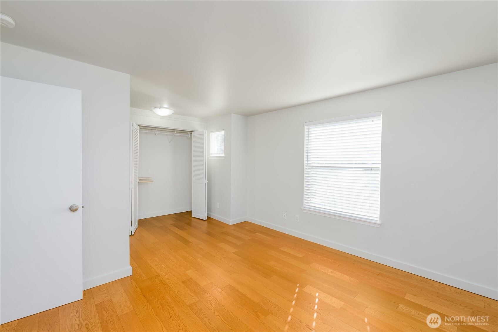 131 Alpine Loop Sequim, WA 98382 - Photo 25 of 40 a view of a bedroom with a bed and a window