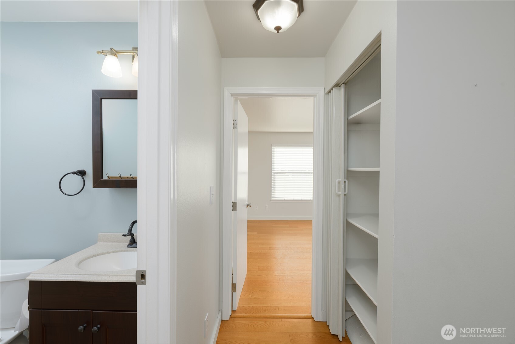 131 Alpine Loop Sequim, WA 98382 - Photo 29 of 40 a bathroom with a sink and a mirror