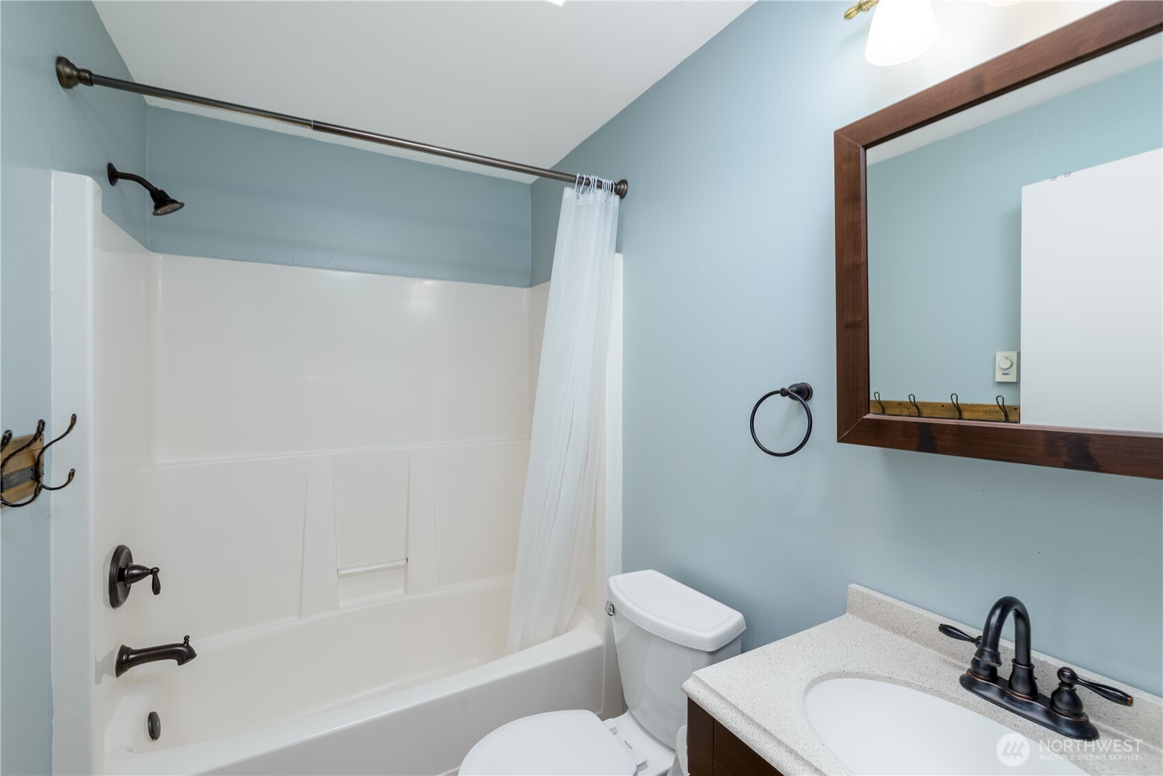 131 Alpine Loop Sequim, WA 98382 - Photo 30 of 40 a bathroom with a sink toilet and shower